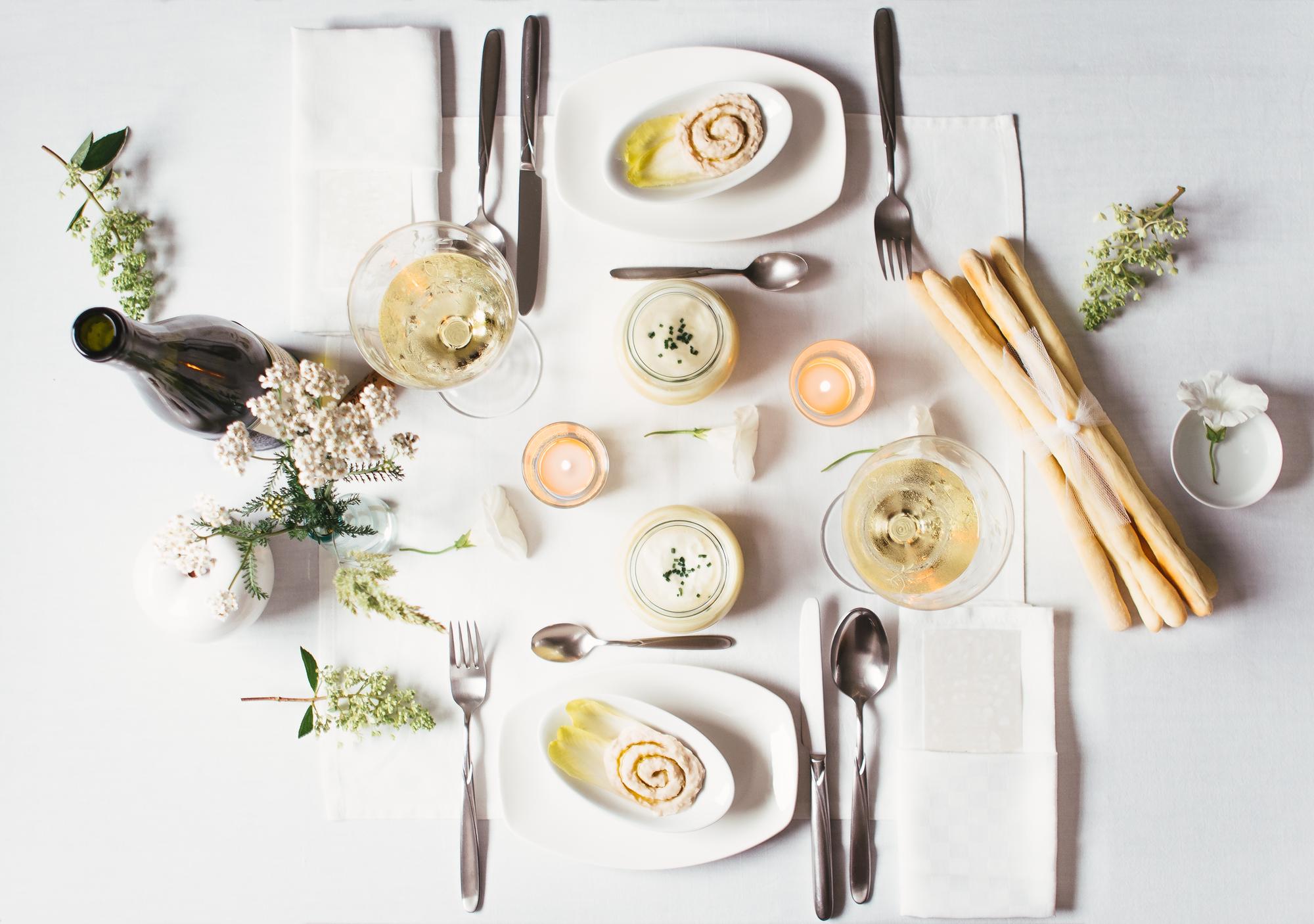 Long table set for a tasting dinner with candles